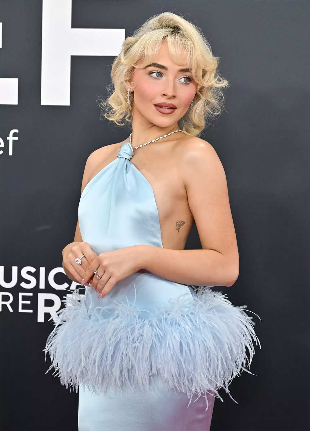 Why Celebrities Like Sabrina Carpenter Use Wigs or Extensions